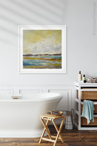 Coastal abstract landscape art "Lapping Layers," digital download by Victoria Primicias, decorates the bathroom.
