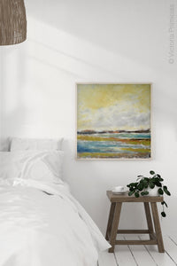 Yellow coastal abstract landscape painting "Lapping Layers," giclee print by Victoria Primicias, decorates the bedroom.