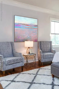 Sweet square abstract beach painting "Marathon Miles," printable wall art by Victoria Primicias, decorates the bedroom.