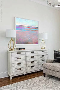 Sweet square abstract seascape painting "Marathon Miles," printable wall art by Victoria Primicias, decorates the living room.