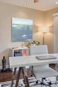 Neutral color abstract seascape painting "Marthas Shallows," downloadable art by Victoria Primicias, decorates the office.