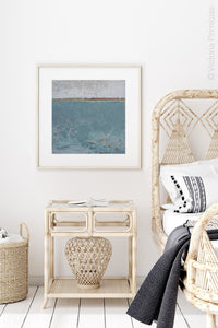 Teal abstract beach painting "Merchant Crossing," printable wall art by Victoria Primicias, decorates the bedroom.