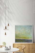 Load image into Gallery viewer, Chartreuse abstract landscape painting &quot;Merchant Skies,&quot; digital art by Victoria Primicias, decorates the dining room.
