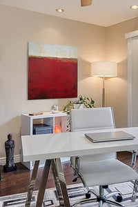 Red abstract beach artwork "Merlot Passage," canvas art print by Victoria Primicias, decorates the office.