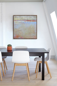 Contemporary beige abstract ocean painting "Migrant Shores," digital print by Victoria Primicias, decorates the office.