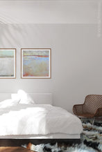 Load image into Gallery viewer, Contemporary coastal abstract ocean painting &quot;Migrant Shores,&quot; canvas art print by Victoria Primicias, decorates the bedroom.
