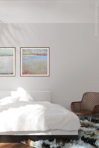 Contemporary coastal abstract ocean painting "Migrant Shores," canvas art print by Victoria Primicias, decorates the bedroom.