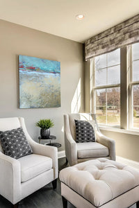 Large abstract ocean painting "Mint Melody," canvas wall art by Victoria Primicias, decorates the living room.