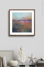 Load image into Gallery viewer, Orange abstract landscape painting &quot;Minuet,&quot; digital print by Victoria Primicias, decorates the shelf.
