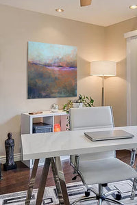 Orange abstract ocean painting "Minuet," fine art print by Victoria Primicias, decorates the office.