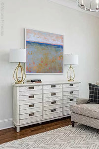 Impressionist abstract ocean wall art "Naval Circus," digital print by Victoria Primicias, decorates the living room.