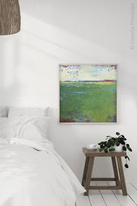 Green landscape painting "On Course," digital print by Victoria Primicias, decorates the bedroom.