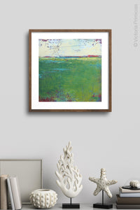 Green abstract landscape painting "On Course," fine art print by Victoria Primicias, decorates the wall.
