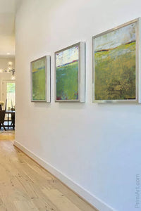 Green abstract landscape art "On Course," canvas wall art by Victoria Primicias, decorates the entryway.
