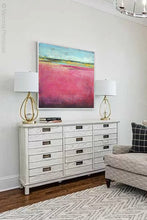 Load image into Gallery viewer, Pink abstract beach artwork &quot;Painted Lady,&quot; canvas print by Victoria Primicias, decorates the living room.
