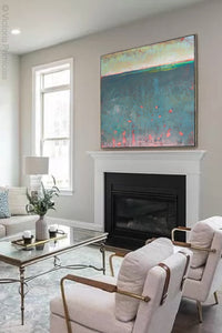 Bluegreen abstract beach artwork "Patrician Lake," canvas print by Victoria Primicias, decorates the fireplace.