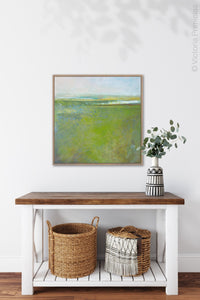 Square contemporary abstract coastal wall art "Peridot Pastures," printable wall art by Victoria Primicias, decorates the entryway.