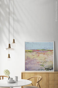 Colorful landscape painting "Pink Parade," downloadable art by Victoria Primicias, decorates the dining room.