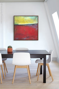 Red and yellow abstract seascape painting "Poppy Love," wall art print by Victoria Primicias, decorates the office.