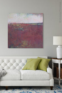 Burgundy abstract beach art "Red Tide," downloadable art by Victoria Primicias, decorates the living room.