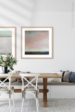Load image into Gallery viewer, Large abstract coastal wall art &quot;Retiring Sky,&quot; digital art landscape by Victoria Primicias, decorates the dining room.
