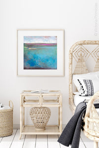 Turquoise abstract beach wall art "Rising Tides," metal print by Victoria Primicias, decorates the bedroom.