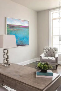 Turquoise abstract coastal wall art "Rising Tides," fine art print by Victoria Primicias, decorates the office.