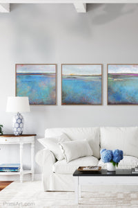 Turquoise abstract coastal wall art "Rising Tides," fine art print by Victoria Primicias, decorates the living room.