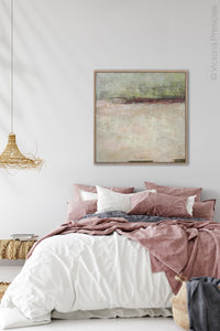 Neutral color abstract landscape art "Ruby Landing," digital print by Victoria Primicias, decorates the bedroom.