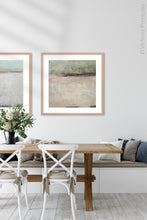 Load image into Gallery viewer, Neutral color landscape painting &quot;Ruby Landing,&quot; digital print by Victoria Primicias, decorates the dining room.
