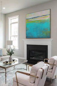 Turquoise abstract beach wall decor "Shallow Time," digital print by Victoria Primicias, decorates the fireplace.