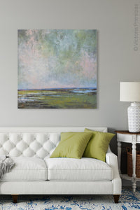 Large coastal abstract landscape art "Shifting Winds," digital artwork by Victoria Primicias, decorates the living room.