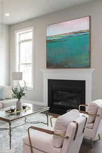 Large teal abstract landscape painting "Siesta Seas," digital print by Victoria Primicias, decorates the fireplace.