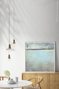 Contemporary abstract ocean painting "Silver Springs," digital artwork by Victoria Primicias, decorates the dining room.