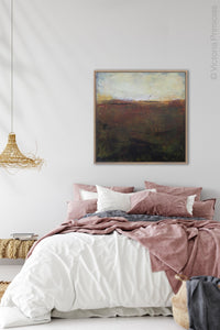 Dark abstract landscape art "Sonorous Seas," digital print by Victoria Primicias, decorates the bedroom.