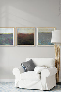 Dark abstract landscape art "Sonorous Seas," digital print by Victoria Primicias, decorates the living room.
