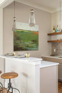Horizon abstract landscape art "Spring Envy," downloadable art by Victoria Primicias, decorates the kitchen.