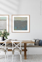 Load image into Gallery viewer, Modern abstract ocean painting &quot;Still Suede,&quot; digital print by Victoria Primicias, decorates the dining room.
