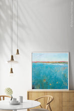 Load image into Gallery viewer, Teal abstract beach wall art &quot;Tethered Basin,&quot; digital print by Victoria Primicias, decorates the dining room.
