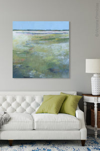 Large abstract landscape art "Thirsty Sheets," printable wall art by Victoria Primicias, decorates the living room.