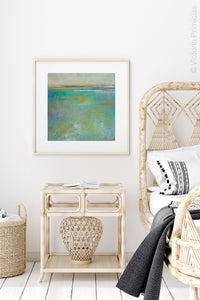 Teal green abstract beach painting "Tropicana Tales," digital download by Victoria Primicias, decorates the bedroom.