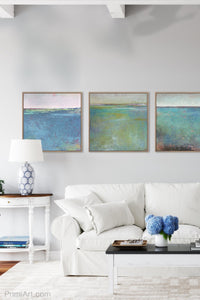 Teal green abstract beach art "Tropicana Tales," digital art landscape by Victoria Primicias, decorates the living room.