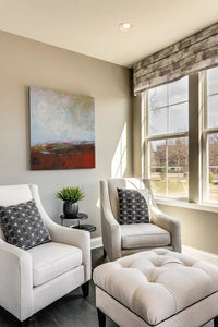 Modern abstract seascape painting"Tuesday's Tempest," digital print by Victoria Primicias, decorates the living room.
