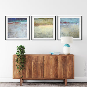 Gray abstract seascape painting "Tuscan Treasures," digital print by Victoria Primicias, decorates the living room.