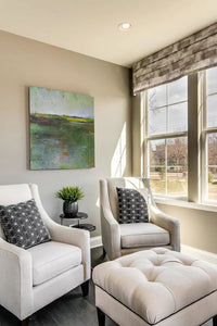 Green abstract landscape art "Verdant Excuse," downloadable art by Victoria Primicias, decorates the living room.